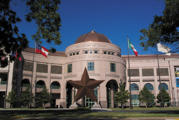 The 33 foot tall Texas bronze star greets visitors in front of the Texas State History Museum