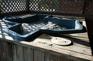 Texas-shaped hot tub big enough for 6 to fit snugly.