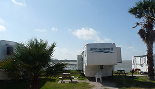 Some sites include Bay-front views, with a view of the Corpus Christi skyline in the distance.