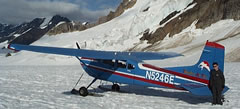 Patrick, alongside our plane, the Cessna 195 Skywagon, after glacier landing