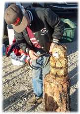 A Quartzsite vendor perfects another bear with his torch