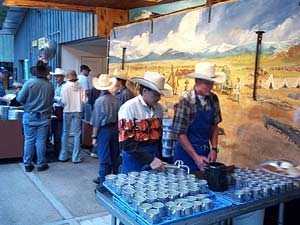 Bar D Chuckwagon workers serving up the lemonade in the serving line