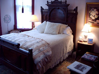 heather's Rose Room, with distinctive high-back bed headboard