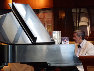 Tony Lara at the piano at the Omni San Antonio Hotel